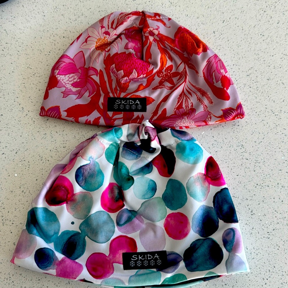 Two good condition fleece lined skida hats